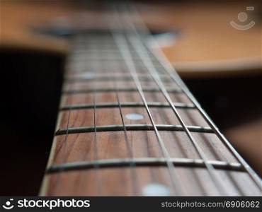 Closeup image of standard six string guitar. Selective focus