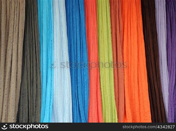 Closeup image of thin bright fabrics at the shop