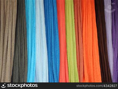 Closeup image of thin bright fabrics at the shop