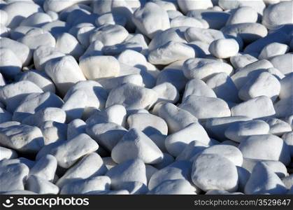 Closeup image of white pebbles on the beach