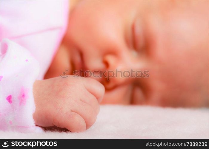 Closeup little newborn baby girl 24 days sleeping