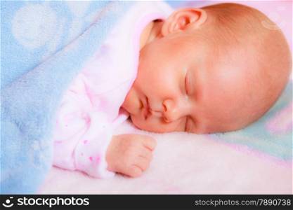 Closeup little newborn baby girl 24 days sleeping