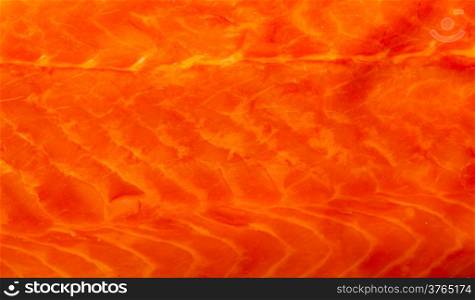 Closeup macro of fresh salmon. Red fish redfish raw meat as food background texture pattern.