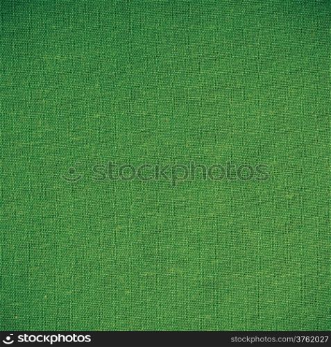 Closeup macro of green fabric textile material as texture pattern background or backdrop. Square format