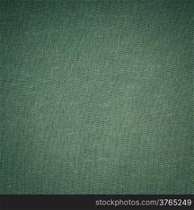 Closeup macro of green fabric textile material as texture pattern background or backdrop. Square format