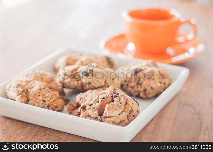 Closeup mixed nut cookies with espresso shot, stock photo