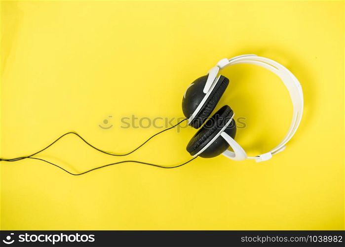 Closeup Music Headphones on a yellow background
