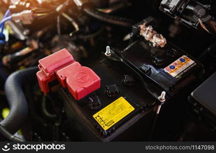 closeup new battery car in engine room / mechanic car battery