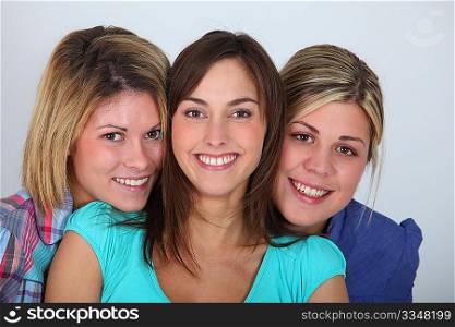 Closeup of 3 young women on white background