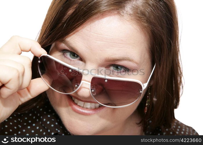 Closeup of a beautiful model wearing stylish sunglasses. White background.