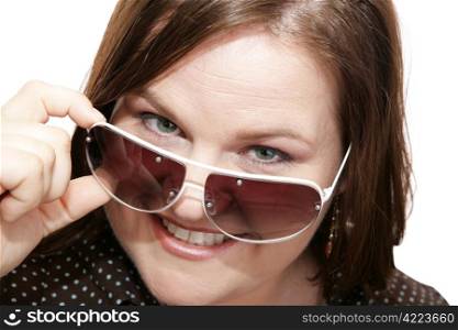 Closeup of a beautiful model wearing stylish sunglasses. White background.