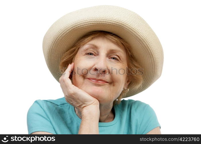 Closeup of a beautiful senior woman in a summer hat. Isolated on white