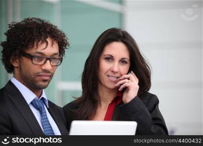 Closeup of a business couple standing outside