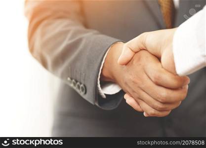 Closeup of a businessman hand shake investor between two colleagues OK, succeed in business Holding hands.