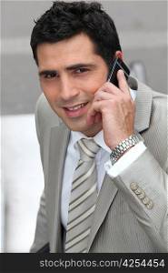 Closeup of a businessman with cellphone