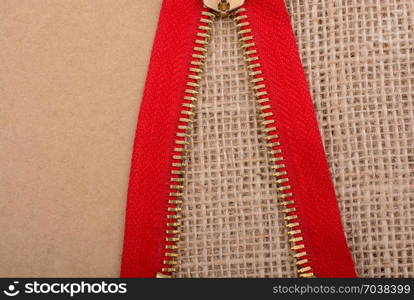 Closeup of a colorful zipper on linen canvas