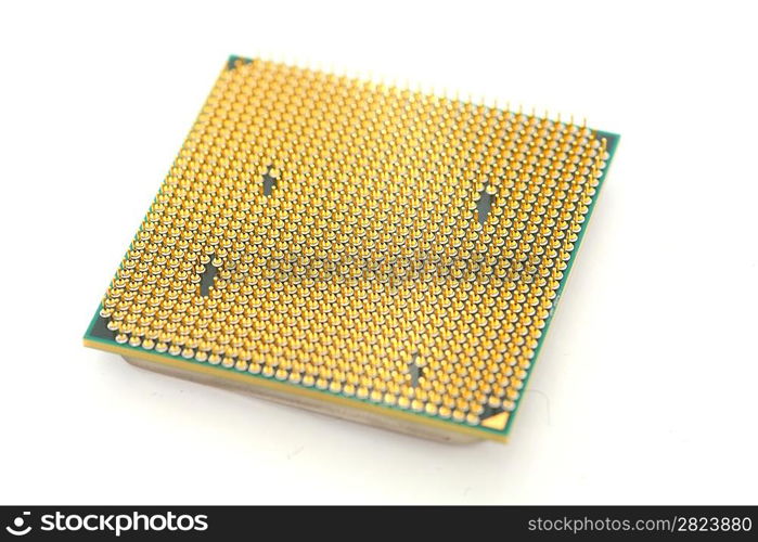 Closeup of a computer processor with golden pins over a white background