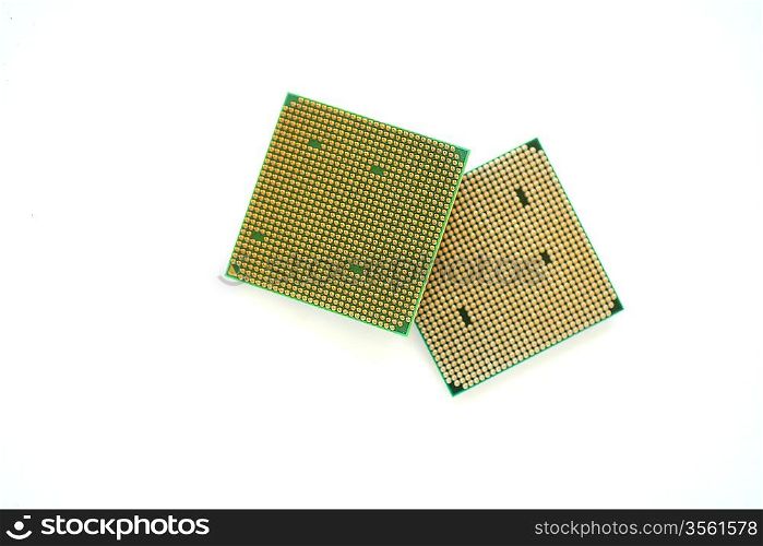 Closeup of a computer processor with golden pins over a white background