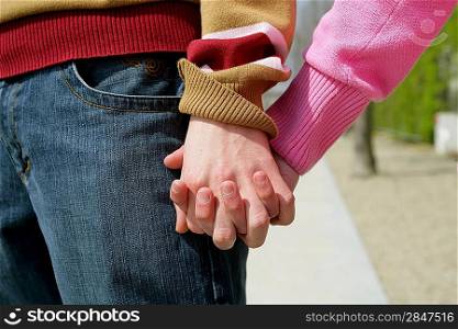 Closeup of a couple holding hands