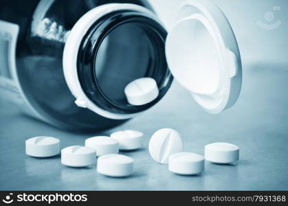 Closeup of a Glass Prescription brown bottle with pills