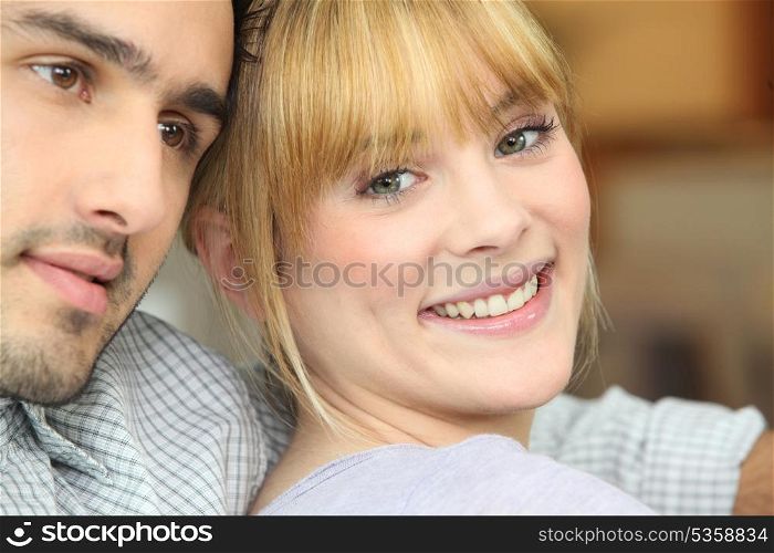 Closeup of a happy young couple at home