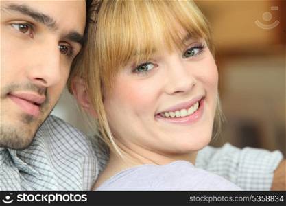 Closeup of a happy young couple at home