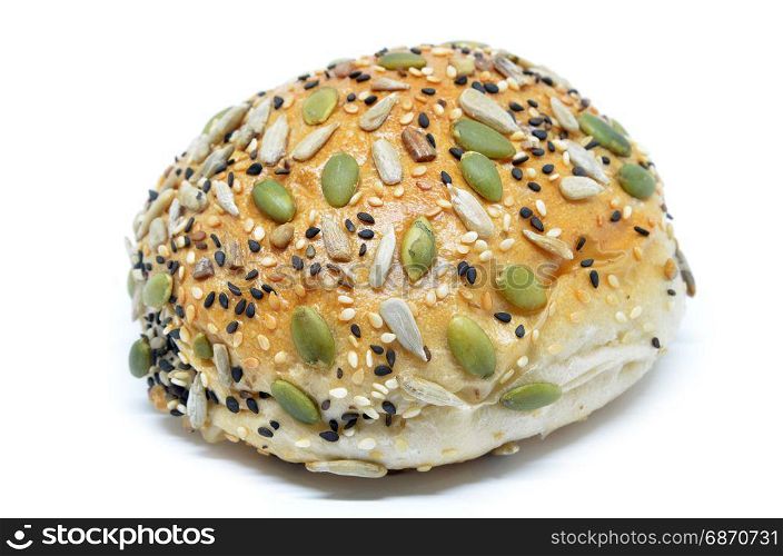 Closeup of a healthy looking bun with pumpkin seed, sunflower seed and sesame