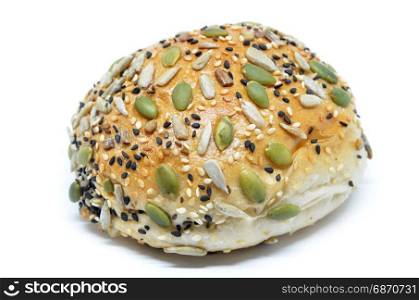 Closeup of a healthy looking bun with pumpkin seed, sunflower seed and sesame