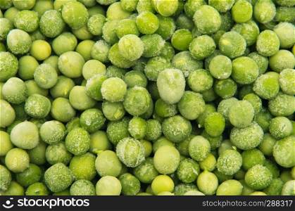Closeup of a heap of frozen peas