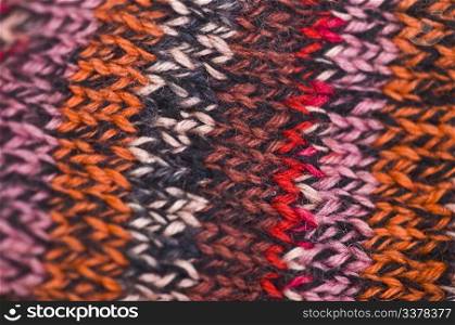 closeup of a knitted piece in colorful stripes