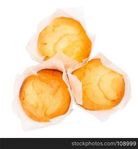 Closeup of a Magdalena Typical Spanish Plain Muffin. Sweet Food or Dessert. Three Fresh Baked Muffin Isolated on White Background in American Style. Irresistible Tasty Cake.
