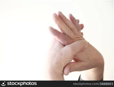 closeup of a man massaging his aching hand