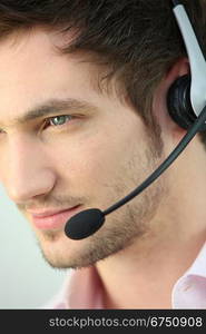 Closeup of a man wearing a headset