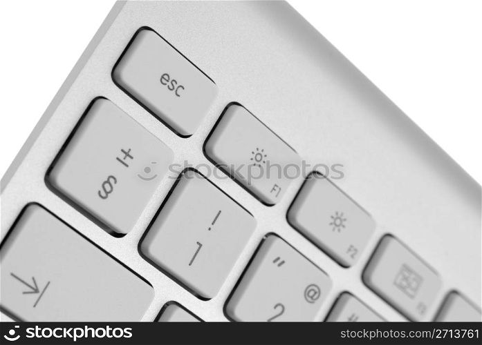 Closeup of a modern aluminium keyboard, focus on the Escape key.