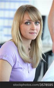 Closeup of a pretty woman in an office environment