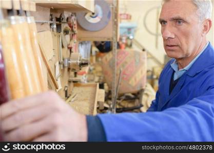 closeup of a senior carpenter working