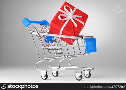 closeup of a shopping cart with gift