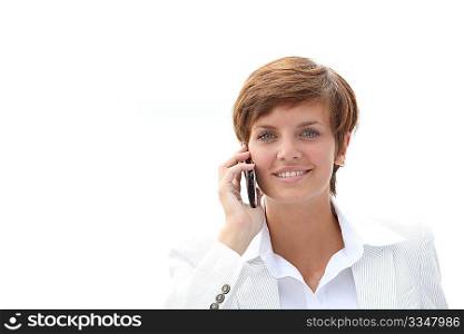 Closeup of a smiling businesswoman talking on the phone