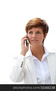 Closeup of a smiling businesswoman talking on the phone