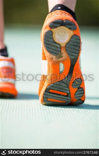 Closeup of a track runner doing jogging