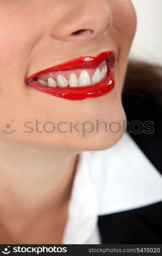 Closeup of a woman wearing red lipstick