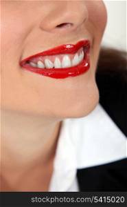 Closeup of a woman wearing red lipstick