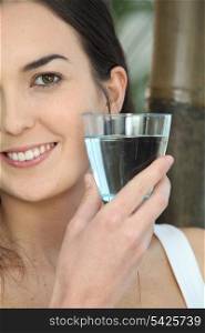 Closeup of a woman with a glass of water
