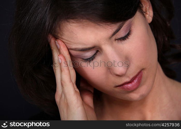 Closeup of a woman with a headache