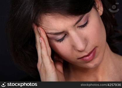 Closeup of a woman with a headache