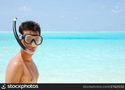 closeup of a young snorkeler man in a tropical island