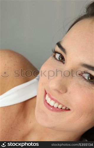 Closeup of a young woman smiling