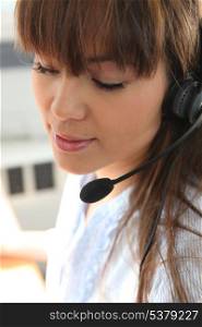 Closeup of a young woman with headset