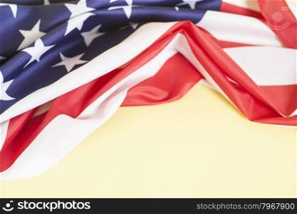 Closeup of American flag on yellow background