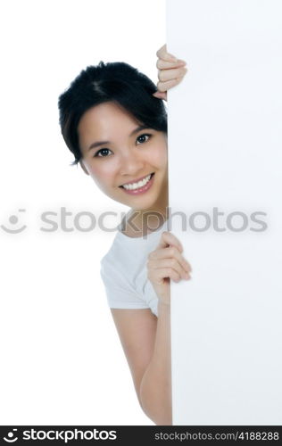 Closeup of an attractive woman holding billboard over white background.